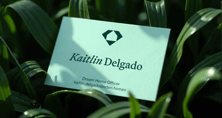 Mint business card resting in tall grass